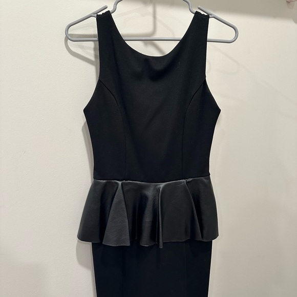 Elegant Black Peplum Dress - Picture 1 of 3